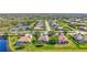 Scenic aerial view of residential community featuring well-manicured lawns, mature trees, and tranquil ponds at 110 167Th E Blvd, Bradenton, FL 34212