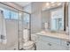 Neat bathroom with a glass-enclosed shower, single vanity, and toilet providing all essentials at 110 167Th E Blvd, Bradenton, FL 34212