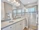 Clean bathroom featuring a glass enclosed shower, a single vanity, and modern fixtures at 110 167Th E Blvd, Bradenton, FL 34212