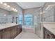 Spacious bathroom with double vanity, garden tub, and glass enclosed shower providing a spa-like retreat at 110 167Th E Blvd, Bradenton, FL 34212