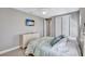 Comfortable bedroom with wall mounted television and ensuite bathroom entrance for added privacy at 110 167Th E Blvd, Bradenton, FL 34212