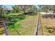 Fenced dog park with green grass and mature shade trees in a residential community at 110 167Th E Blvd, Bradenton, FL 34212