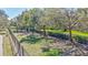 Community dog park provides a secure area with mature trees where pets can exercise and socialize at 110 167Th E Blvd, Bradenton, FL 34212