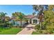 Attractive single-story home featuring a brick driveway and lush landscaping at 110 167Th E Blvd, Bradenton, FL 34212