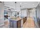Open kitchen design with a large central island, stainless appliances, and seamless flow to living area at 110 167Th E Blvd, Bradenton, FL 34212