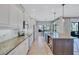 Bright kitchen with white cabinets, granite counters, stainless appliances, and a center island at 110 167Th E Blvd, Bradenton, FL 34212