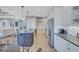 Open layout kitchen featuring stainless appliances, white cabinets, granite countertops, and large center island at 110 167Th E Blvd, Bradenton, FL 34212
