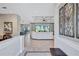 Open-concept living room boasts tile floors, coffered ceilings, and seamless indoor-outdoor flow at 110 167Th E Blvd, Bradenton, FL 34212