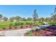 Community park with a well-maintained soccer field, walking path, and lush landscaping under a clear blue sky at 110 167Th E Blvd, Bradenton, FL 34212