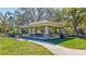 Community picnic pavilion with tables, benches, and lush greenery for outdoor gatherings at 110 167Th E Blvd, Bradenton, FL 34212