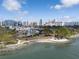 Breathtaking aerial view showcasing city skyline, a waterfront park, and luxury condos at 111 S Pineapple Ave # 918, Sarasota, FL 34236