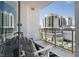 Relaxing balcony view with chairs and a stunning view of a high-rise building at 111 S Pineapple Ave # 918, Sarasota, FL 34236