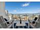 Outdoor balcony furniture including chairs, outdoor rug, and amazing city views at 111 S Pineapple Ave # 918, Sarasota, FL 34236