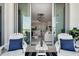 Balcony view into the home with a chandelier, modern kitchen and living area at 111 S Pineapple Ave # 918, Sarasota, FL 34236
