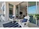 Balcony with sliding glass doors leading to a modern living area and bedroom at 111 S Pineapple Ave # 918, Sarasota, FL 34236