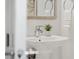 Bright bathroom featuring a modern sink, chrome faucet, and decorative plant at 111 S Pineapple Ave # 918, Sarasota, FL 34236