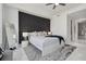 Inviting bedroom with a dark accent wall, king bed and stylish rug at 111 S Pineapple Ave # 918, Sarasota, FL 34236