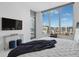 Bright bedroom with a city view and a modern king bed with soft textures at 111 S Pineapple Ave # 918, Sarasota, FL 34236