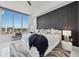 Inviting bedroom with a dark accent wall, king bed and floor-to-ceiling windows at 111 S Pineapple Ave # 918, Sarasota, FL 34236