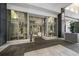 Contemporary building entrance featuring glass doors, sleek signage, and minimalist landscaping for a welcoming atmosphere at 111 S Pineapple Ave # 918, Sarasota, FL 34236