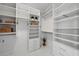 Walk-in closet featuring built-in shelving and storage drawers at 111 S Pineapple Ave # 918, Sarasota, FL 34236