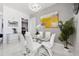 Stylish dining area featuring a modern glass table, comfortable seating, and elegant decor, perfect for gatherings and meals at 111 S Pineapple Ave # 918, Sarasota, FL 34236