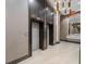 Modern elevator area featuring sleek elevators, contemporary lighting, and a stylish mirror for a sophisticated look at 111 S Pineapple Ave # 918, Sarasota, FL 34236