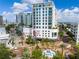 Condominium building with a stylish pineapple mural and a vibrant street scene at 111 S Pineapple Ave # 918, Sarasota, FL 34236