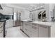 Contemporary kitchen features stainless steel appliances, an island with sink, and elegant backsplash at 111 S Pineapple Ave # 918, Sarasota, FL 34236