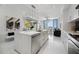 Modern kitchen featuring a large island with stainless steel appliances and an open concept design at 111 S Pineapple Ave # 918, Sarasota, FL 34236