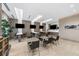 Modern resident lounge equipped with multiple TVs, individual workstations, and comfortable seating areas at 111 S Pineapple Ave # 918, Sarasota, FL 34236