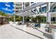 Outdoor lounge with comfortable seating and lush landscaping, perfect for relaxing and enjoying the weather at 111 S Pineapple Ave # 918, Sarasota, FL 34236
