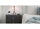 Close up of modern nightstand with drawers, stylish lamp, and decorative succulent at 111 S Pineapple Ave # 918, Sarasota, FL 34236
