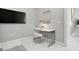 Modern office space with a sleek white desk, comfortable chair, contemporary artwork, and ample lighting for a productive workspace at 111 S Pineapple Ave # 918, Sarasota, FL 34236