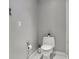 Minimalist powder room with white toilet and modern fixtures at 111 S Pineapple Ave # 918, Sarasota, FL 34236