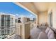 Condo balcony featuring comfortable seating and stunning city views at 1111 Ritz Carlton Dr # 1704, Sarasota, FL 34236