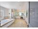 Bright bathroom features a soaking tub, glass enclosed shower, double vanity, tile flooring, and bright natural light at 1111 Ritz Carlton Dr # 1704, Sarasota, FL 34236