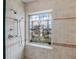 Shower with decorative glass window and neutral tile at 1111 Ritz Carlton Dr # 1704, Sarasota, FL 34236