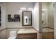 Stylish bathroom with a mirror, vanity, and tiled shower at 1111 Ritz Carlton Dr # 1704, Sarasota, FL 34236