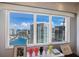 Bright condo windows feature a clear downtown and water view with colorful decor on the windowsill at 1111 Ritz Carlton Dr # 1704, Sarasota, FL 34236