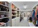 Walk-in closet features custom shelving, drawers, and space to hang your clothes at 1111 Ritz Carlton Dr # 1704, Sarasota, FL 34236