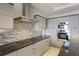 Modern kitchen features granite countertops, stainless steel appliances, and ample cabinet space at 1111 Ritz Carlton Dr # 1704, Sarasota, FL 34236