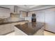 Modern kitchen features granite countertops, stainless steel appliances, and ample cabinet space at 1111 Ritz Carlton Dr # 1704, Sarasota, FL 34236