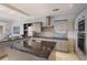 Modern kitchen features granite countertops, stainless steel appliances, and ample cabinet space at 1111 Ritz Carlton Dr # 1704, Sarasota, FL 34236
