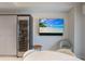 Cozy living room featuring a wall mounted television and a wine fridge at 1111 Ritz Carlton Dr # 1704, Sarasota, FL 34236
