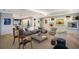 Bright, open living room with modern art, balcony access, and comfortable seating for elegant living at 1111 Ritz Carlton Dr # 1704, Sarasota, FL 34236