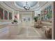 Inviting lobby with elegant chandelier, marble floors, contemporary artwork, and reception desk at 1111 Ritz Carlton Dr # 1704, Sarasota, FL 34236