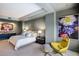 This spacious main bedroom features neutral tones, a comfortable king bed and a modern yellow chair at 1111 Ritz Carlton Dr # 1704, Sarasota, FL 34236