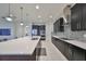 Well-lit kitchen with an island, stainless steel appliances, and modern finishes at 11408 Drifting Leaf Dr, Riverview, FL 33579