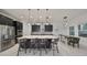 Modern kitchen with a large island, stainless steel appliances, and pendant lighting at 11408 Drifting Leaf Dr, Riverview, FL 33579